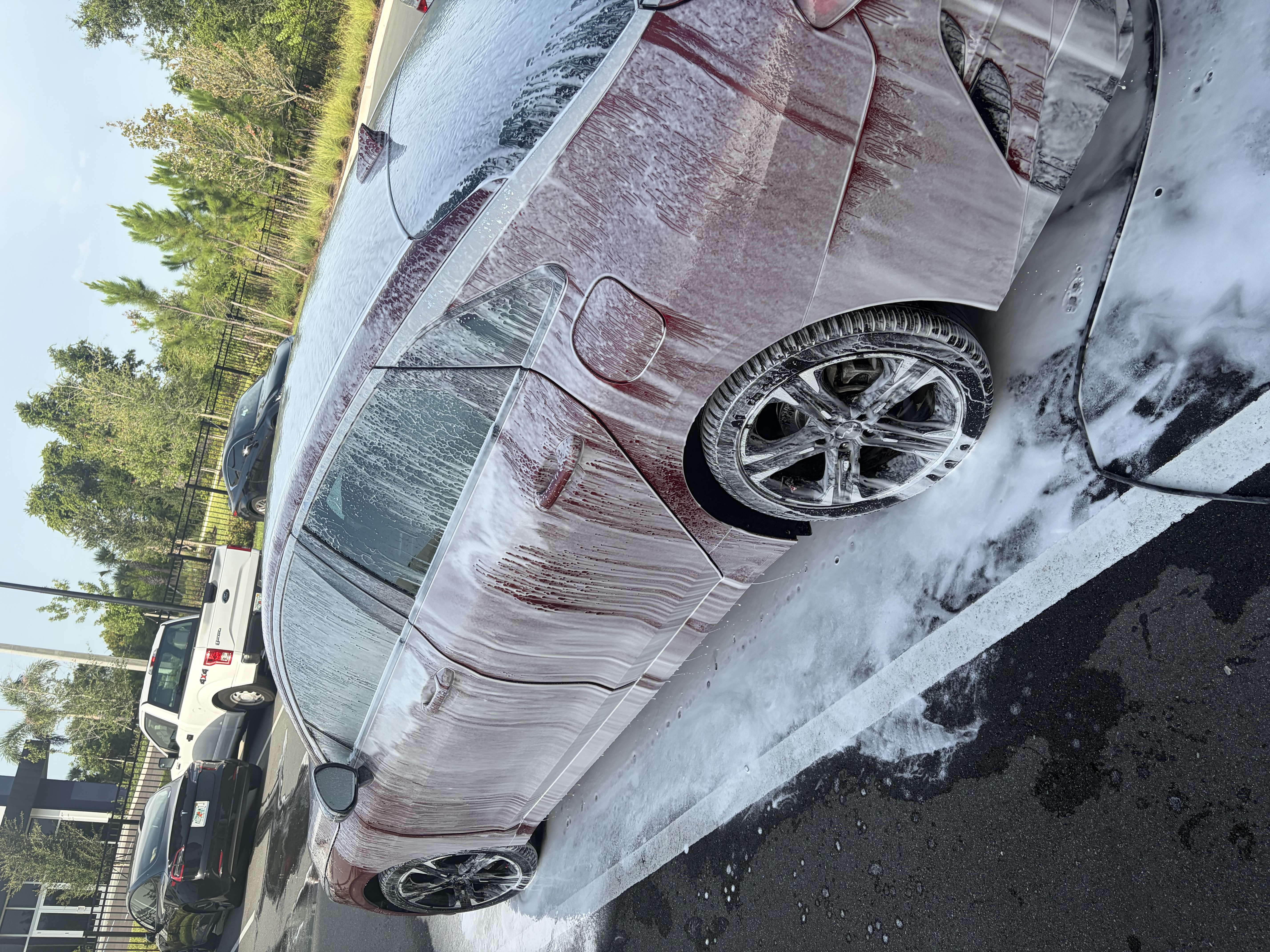 Vehicle receiving a foaming exterior wash